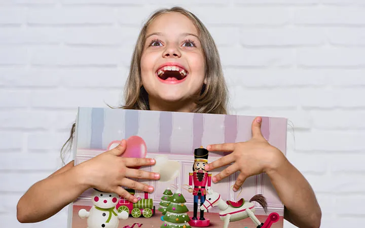 happy child with product packaging happy child with product packaging