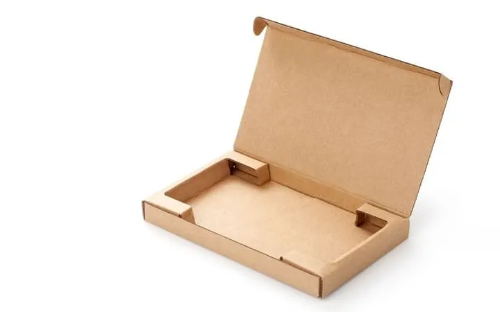 Inlay for cardboard packaging