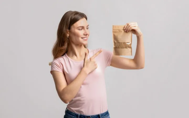 Woman holding kraft paper bag