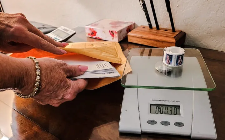 Postage for book and merchandise shipment